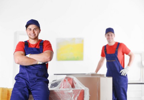 Professional movers in Edgware preparing boxes for a local home relocation