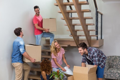 Student removals team helping with boxes in Edgware