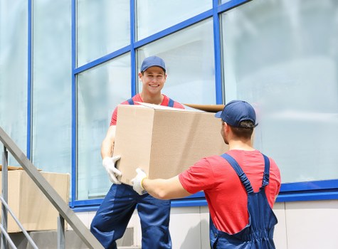 Careful loading of student belongings for transport in Edgware