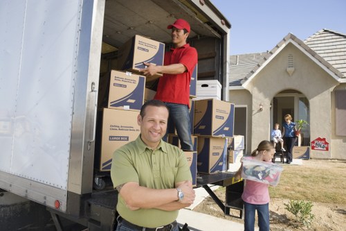 Professional Edgware movers organizing boxes and furniture for transport