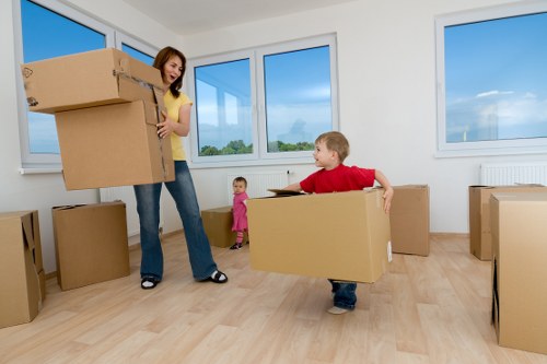 Careful loading of household furniture for a flat relocation in Edgware