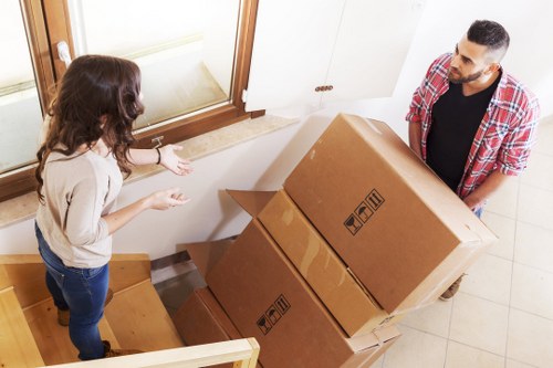 Local moving team loading furniture into a van in Edgware