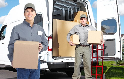 Packed boxes and furniture ready for local storage