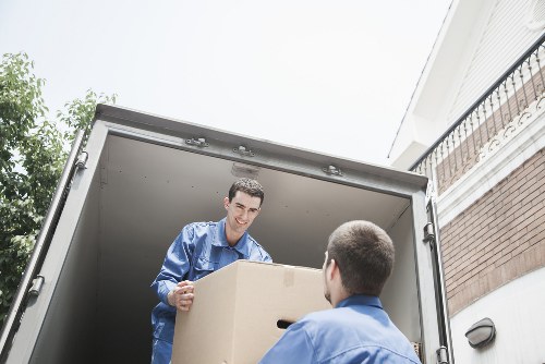Removals team handling furniture during an Edgware house move